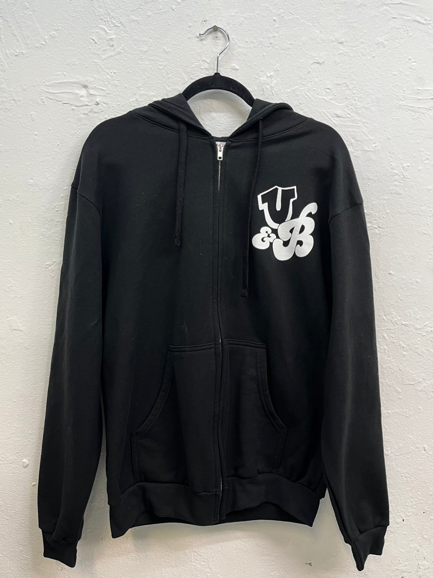 Zipper hoodie featuring the logo with the initials on to right