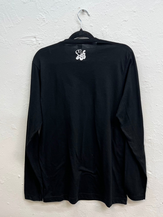 Logo with the initials printed on the back, right below the collar