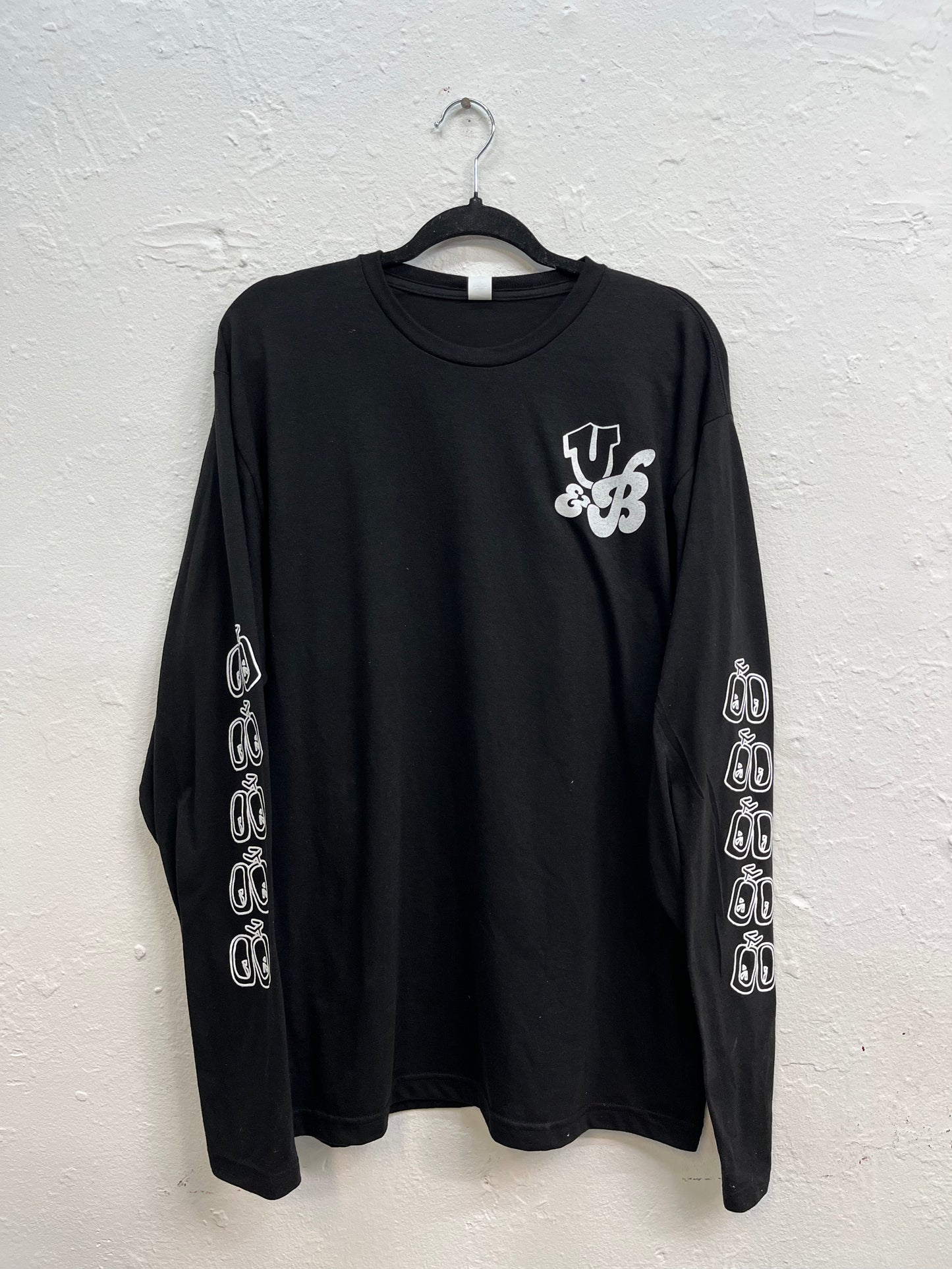 Bicycle pattern printed all over the sleeves, with the U&B initials logo on the top right of the hoodie