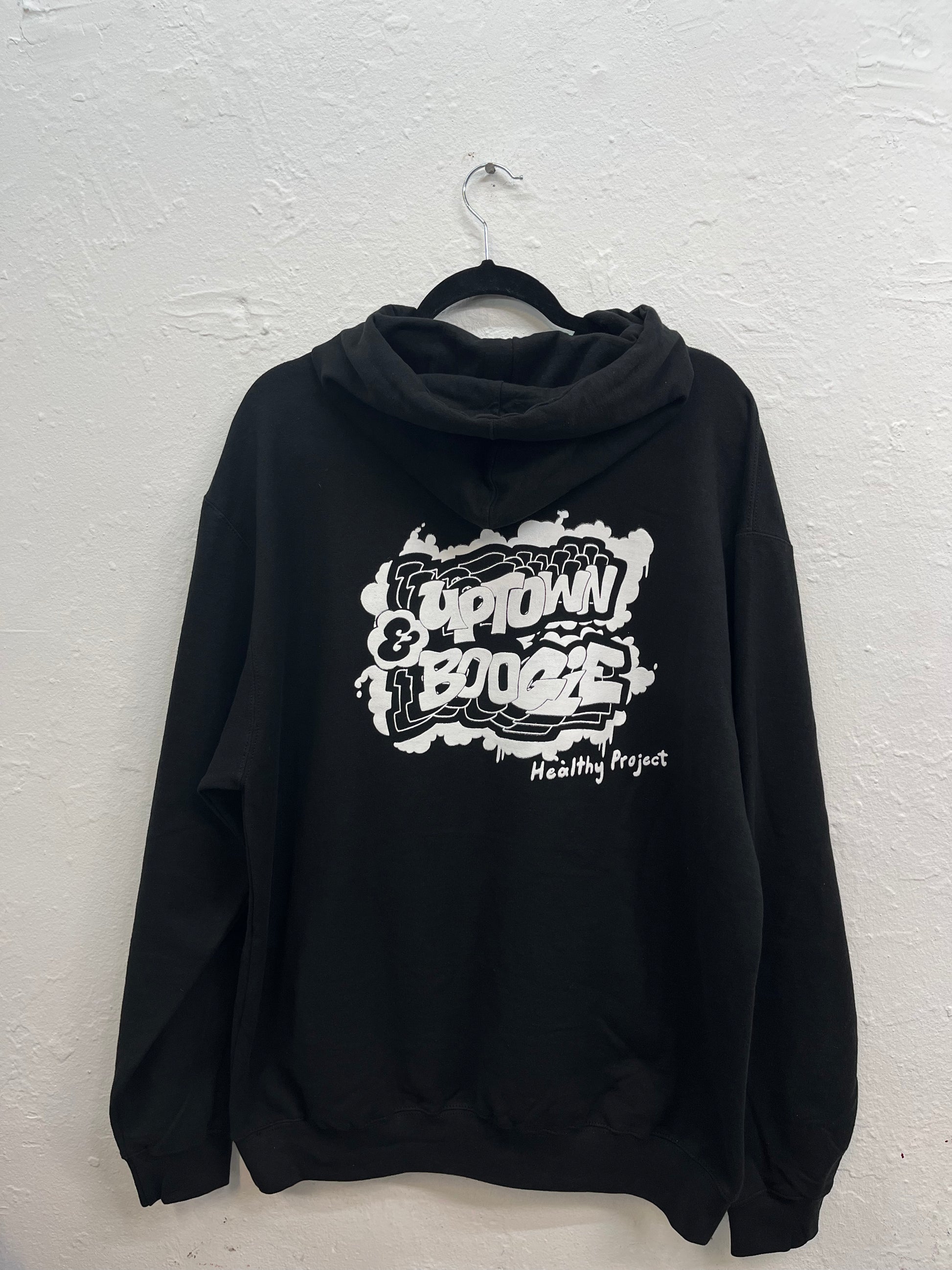 Features a graffiti-style logo on the back, just below the hood