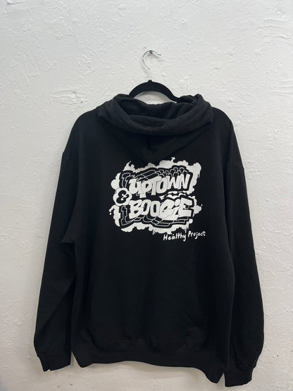 Features a graffiti-style logo on the back, just below the hood